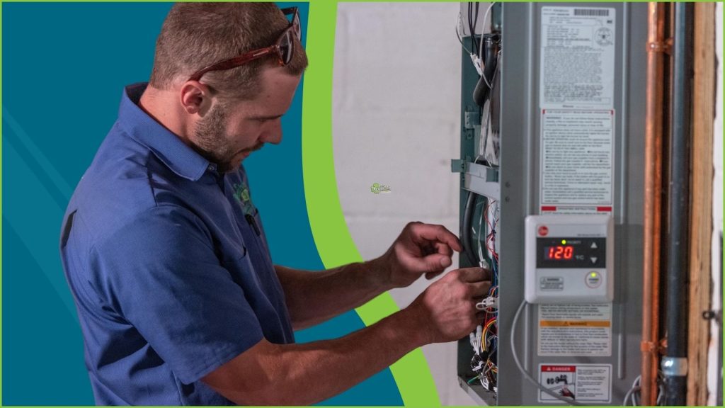 An HVAC tech servicing a heater.