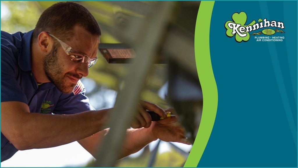 A Kennihan HVAC tech servicing an AC unit in Gibsonia, PA.